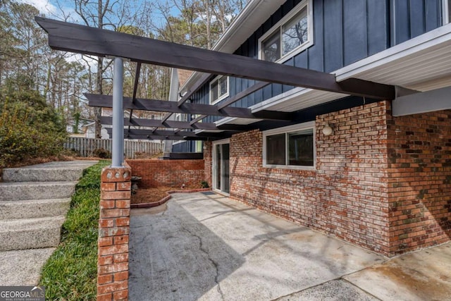 view of patio featuring fence and a pergola