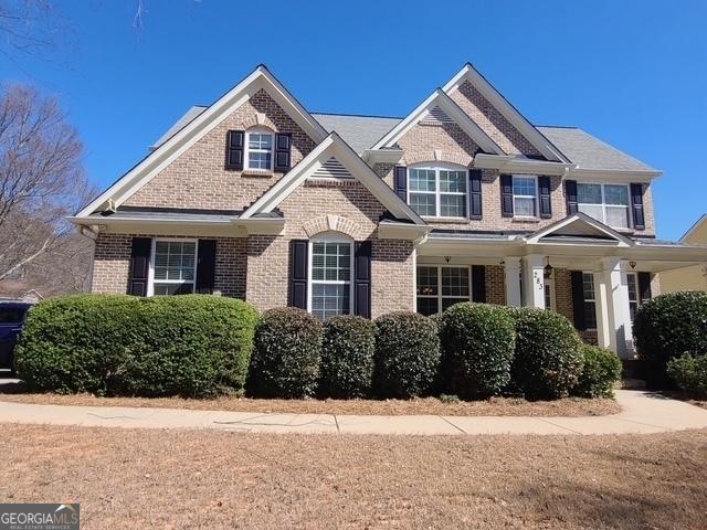 view of front of home with brick siding