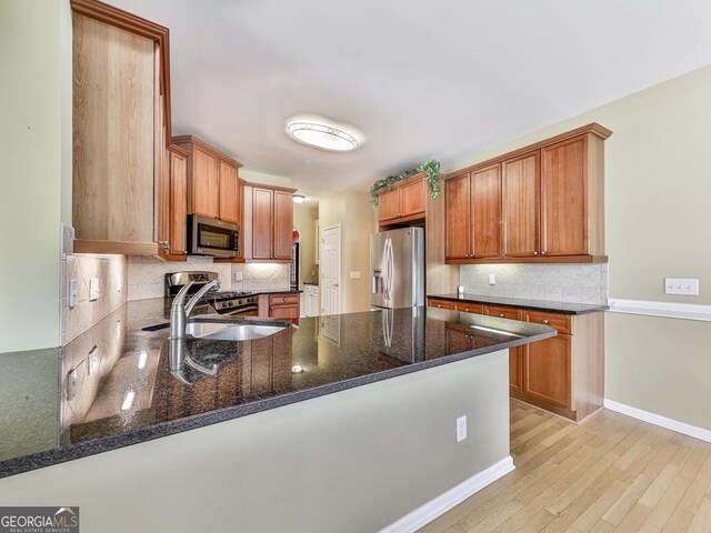 dining space with visible vents, a wainscoted wall, ornamental molding, an inviting chandelier, and light wood-type flooring