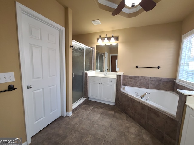 bathroom with visible vents, a ceiling fan, a garden tub, vanity, and a shower stall