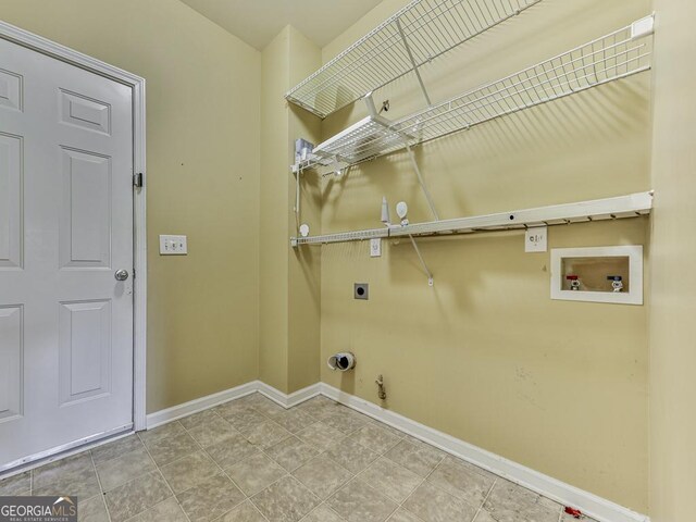 half bath with wood finished floors, toilet, and baseboards