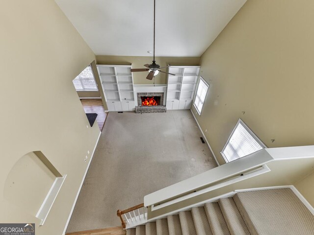 unfurnished bedroom with a ceiling fan, carpet flooring, visible vents, and baseboards