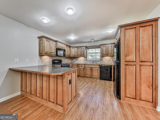 dining space featuring dark wood-type flooring and a fireplace