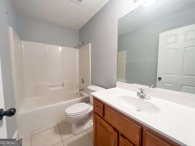 full bathroom featuring tile patterned floors, toilet, vanity, and tub / shower combination