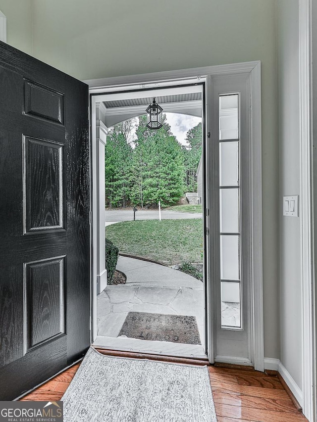 doorway to outside with hardwood / wood-style floors