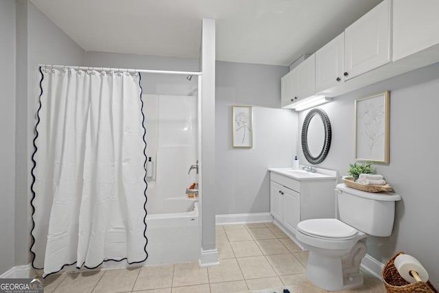 full bath with shower / bath combo, vanity, baseboards, and tile patterned flooring