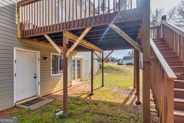 view of yard featuring a carport and stairway