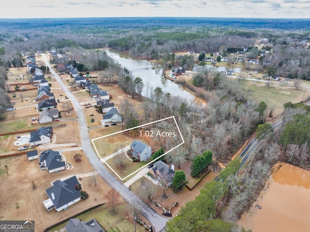 bird's eye view with a residential view and a water view