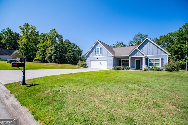 view of front of house featuring a garage and a front yard