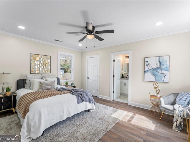 bedroom with ensuite bath, crown molding, ceiling fan, and wood-type flooring