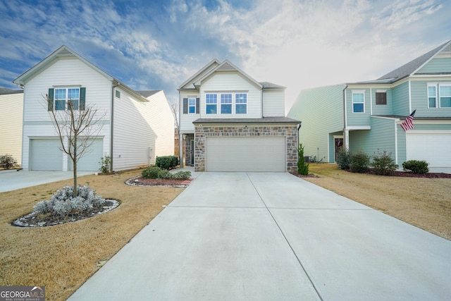 view of front of property with a garage and a front lawn