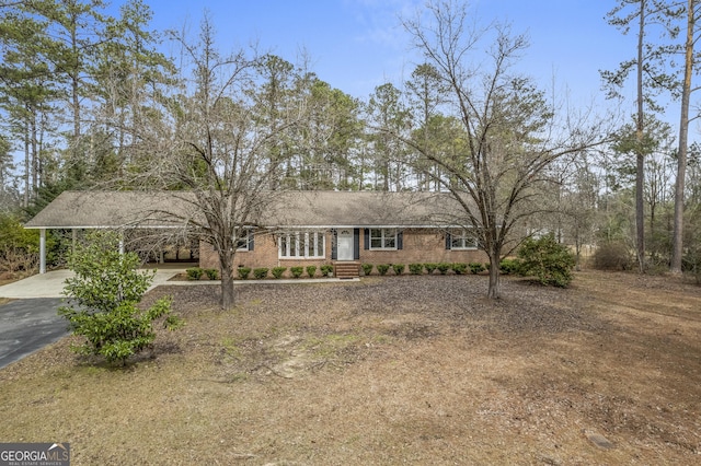 single story home with a carport