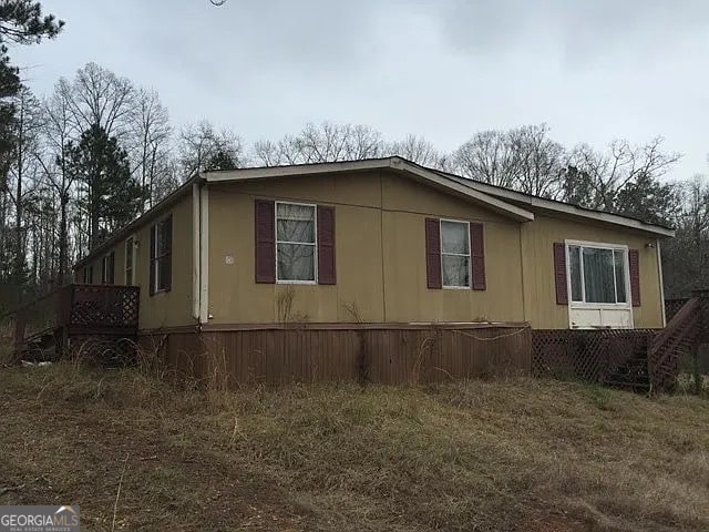 view of home's exterior featuring a yard