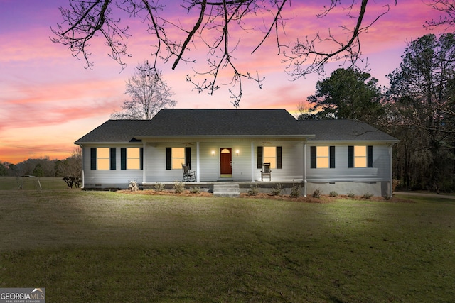 view of front of property featuring a yard and a porch