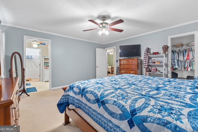 bedroom featuring a textured ceiling, light carpet, crown molding, and a closet