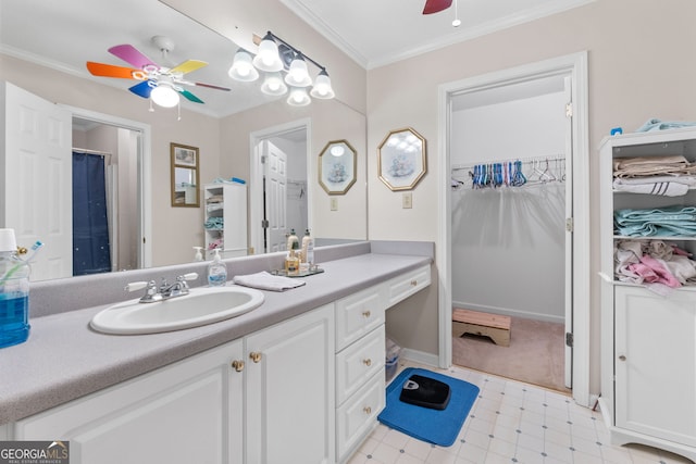 bathroom featuring ceiling fan, vanity, and ornamental molding