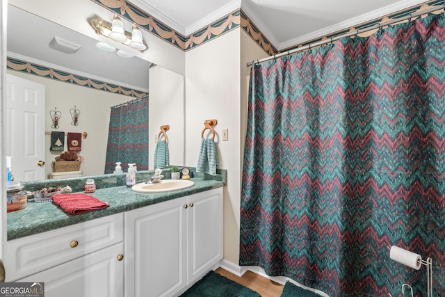 bathroom with vanity and crown molding