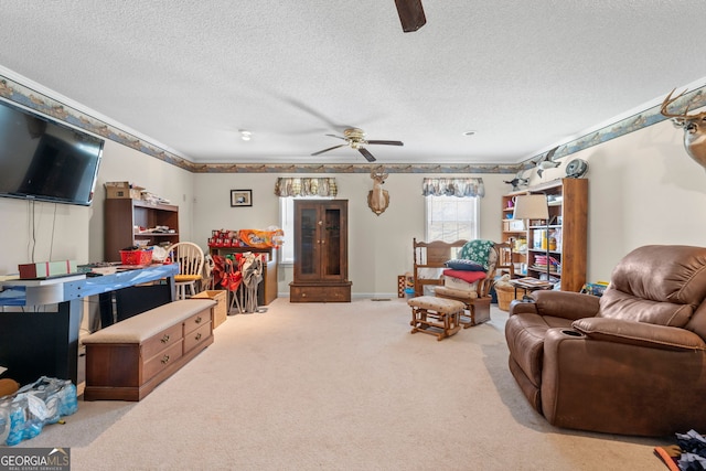 carpeted living room with ceiling fan and a textured ceiling