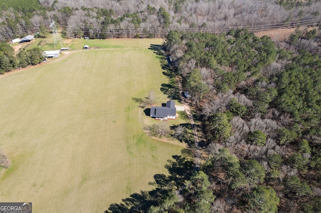 birds eye view of property featuring a rural view