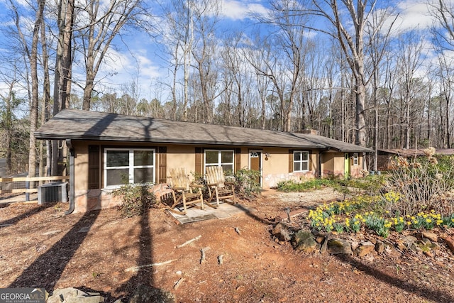 single story home with central air condition unit