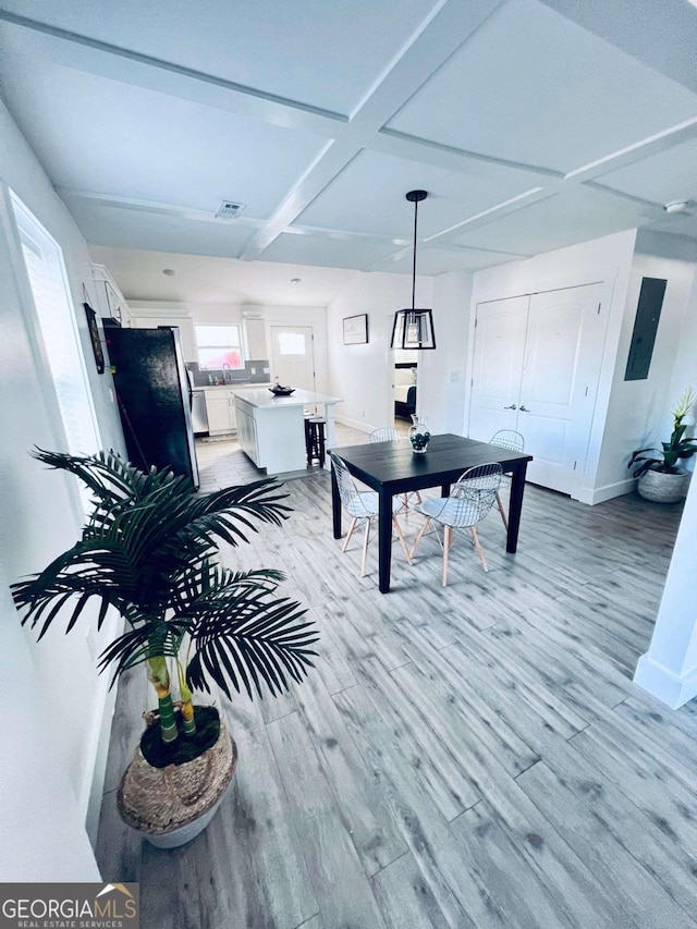 game room with electric panel, light hardwood / wood-style flooring, and coffered ceiling