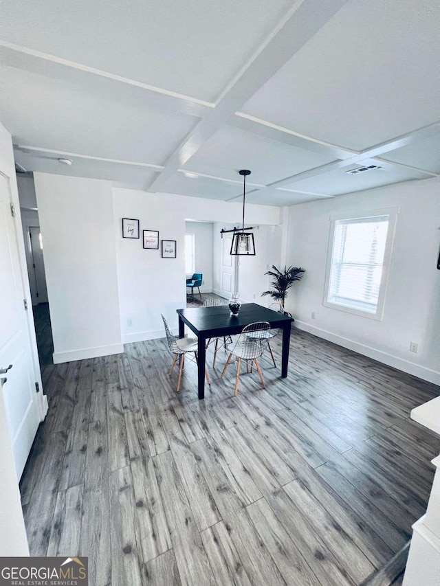 dining area with coffered ceiling, beamed ceiling, and wood-type flooring