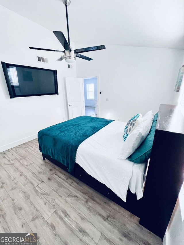 bedroom with ceiling fan and light hardwood / wood-style floors