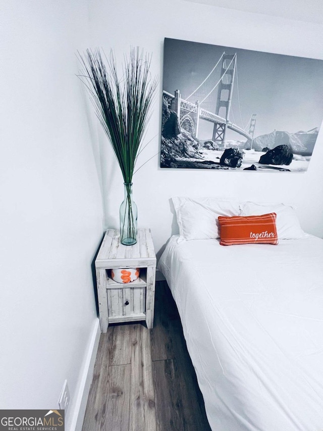 bedroom featuring wood-type flooring