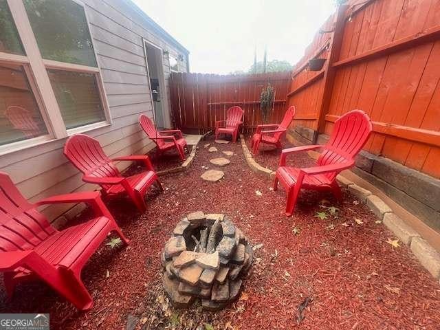 view of patio / terrace featuring a fire pit