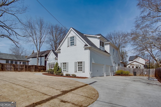 view of side of property with a garage