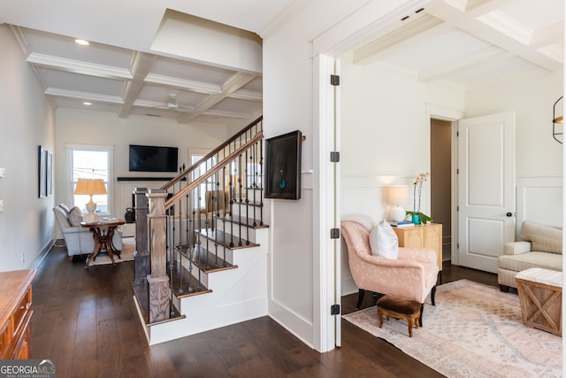 staircase with coffered ceiling, hardwood / wood-style floors, crown molding, and beamed ceiling