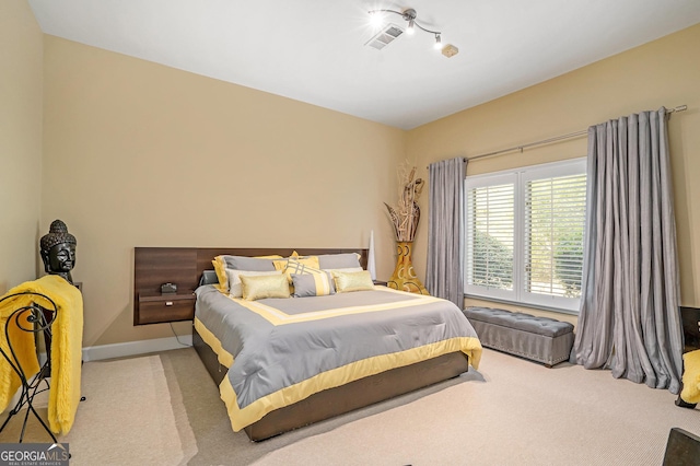 bedroom with carpet flooring, baseboards, and visible vents