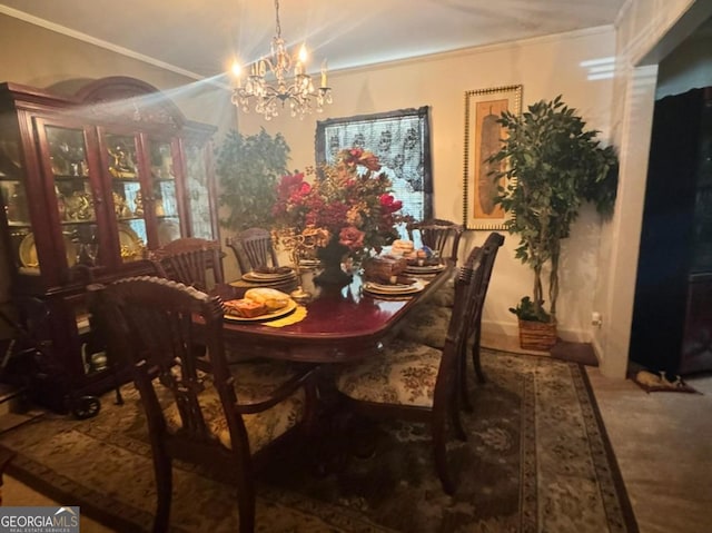 dining room with an inviting chandelier and ornamental molding