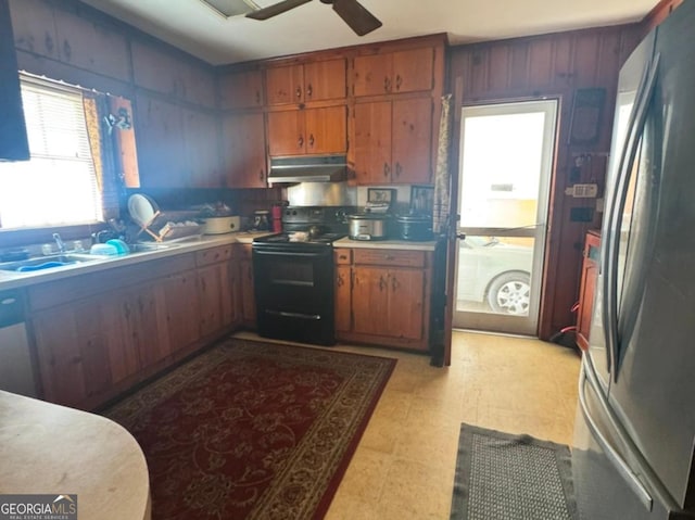 kitchen with ceiling fan, black electric range oven, and stainless steel refrigerator