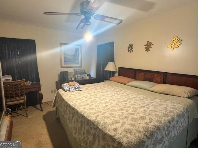 bedroom featuring ceiling fan and carpet floors