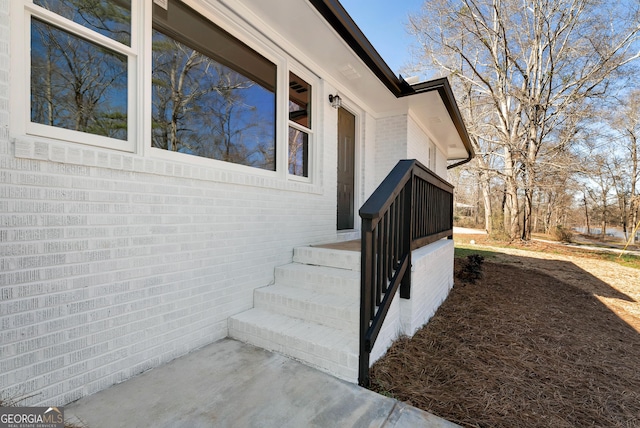 exterior space featuring brick siding