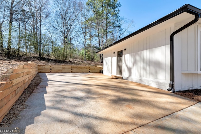 view of side of property with a patio area