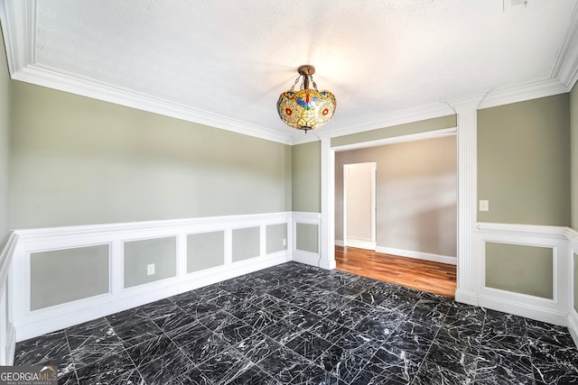 unfurnished room featuring crown molding