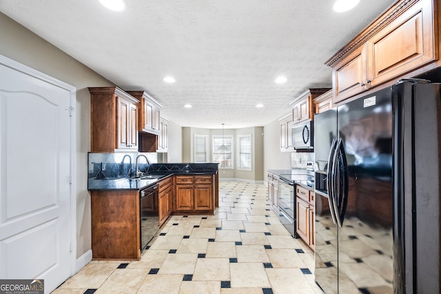 kitchen with sink, backsplash, pendant lighting, black appliances, and kitchen peninsula