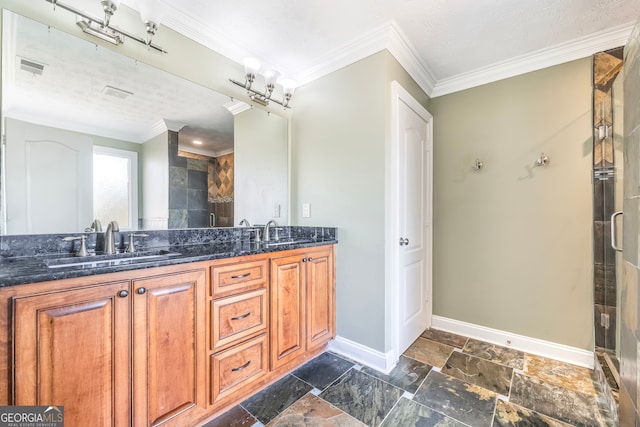 bathroom with crown molding, vanity, and walk in shower