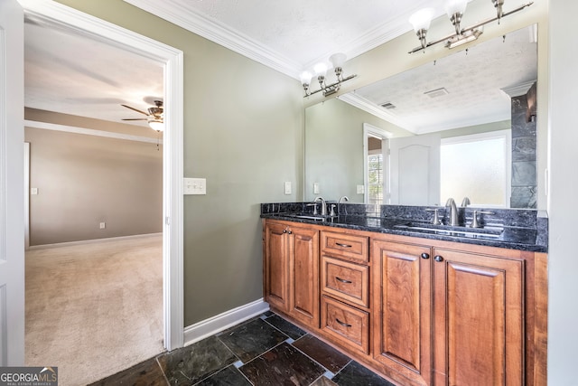 bathroom featuring ceiling fan, vanity, and ornamental molding