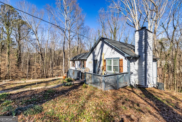 view of side of property with central AC