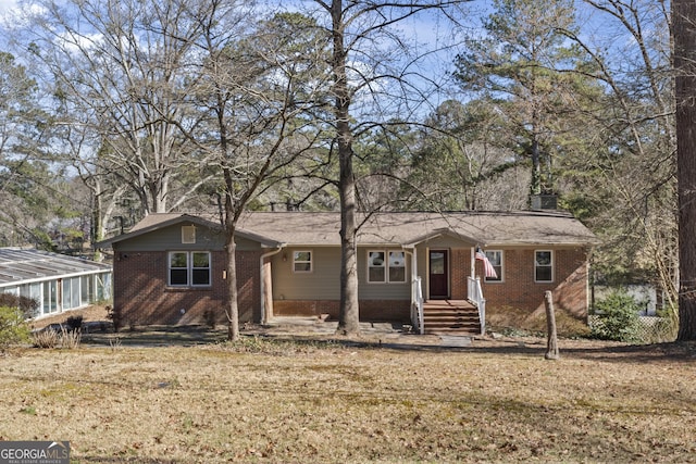 ranch-style house with a front yard