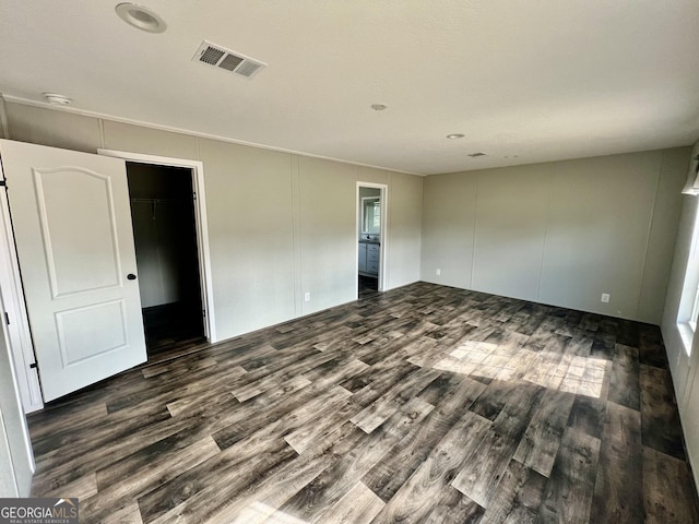 interior space featuring dark hardwood / wood-style floors and a closet