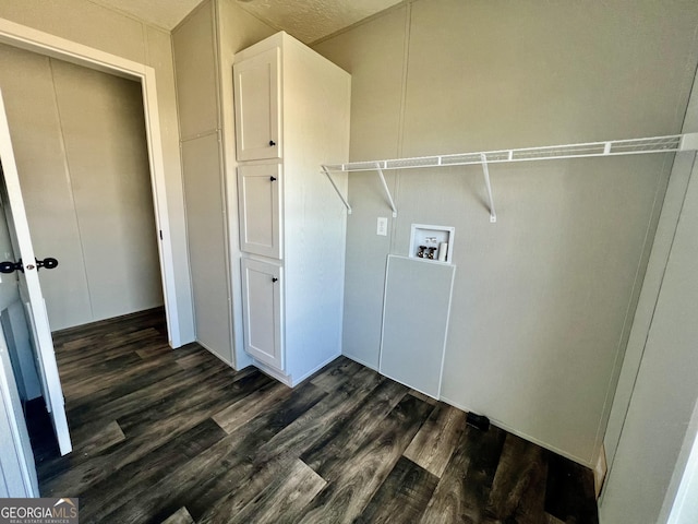 washroom with hookup for a washing machine and dark hardwood / wood-style floors