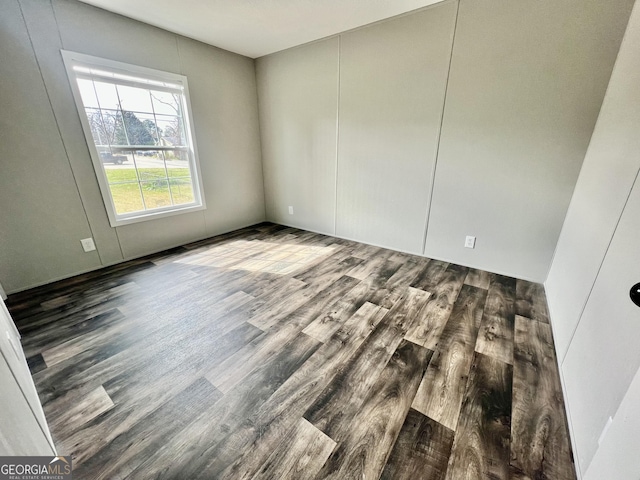 unfurnished room with hardwood / wood-style floors