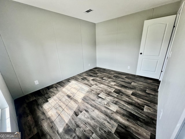 empty room featuring dark hardwood / wood-style floors