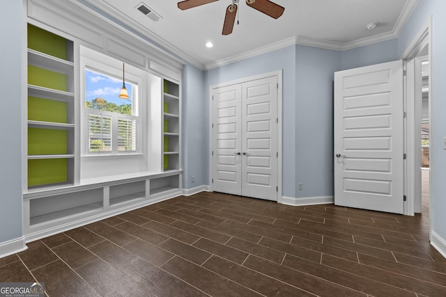 unfurnished bedroom with ceiling fan, a closet, and crown molding