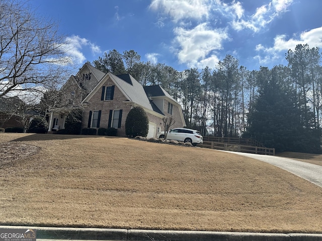 back of house featuring a lawn, a chimney, roof with shingles, crawl space, and a patio area