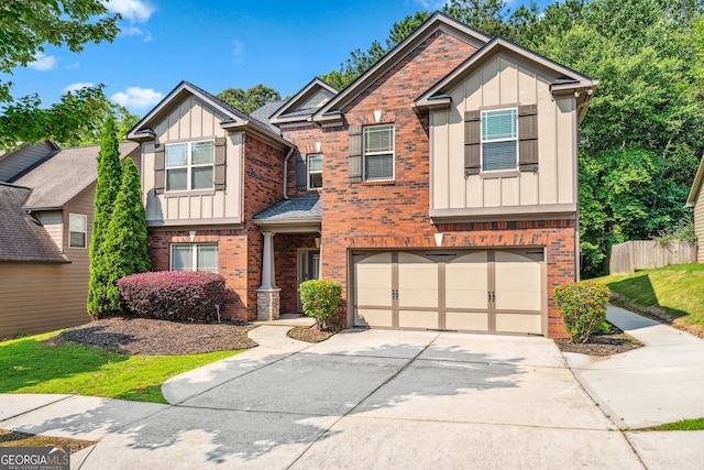 868 Still Hill Ln, Lawrenceville, GA 30045 - craftsman-style home with board and batten siding, brick siding, concrete driveway, and a garage